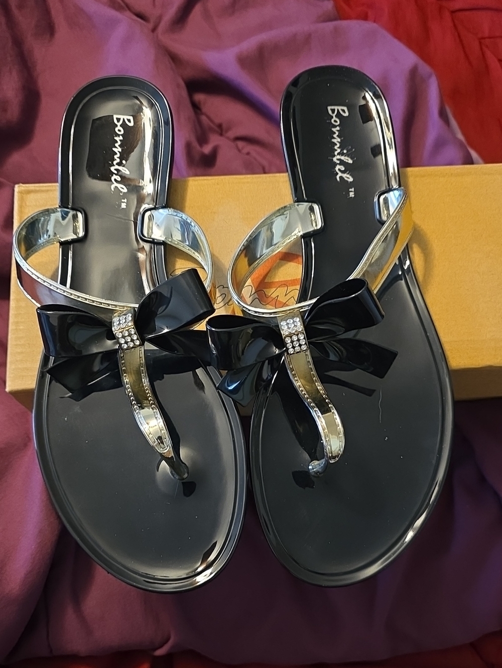 Bonnibel Black Patent Bow Thong Sandals with Metallic Straps